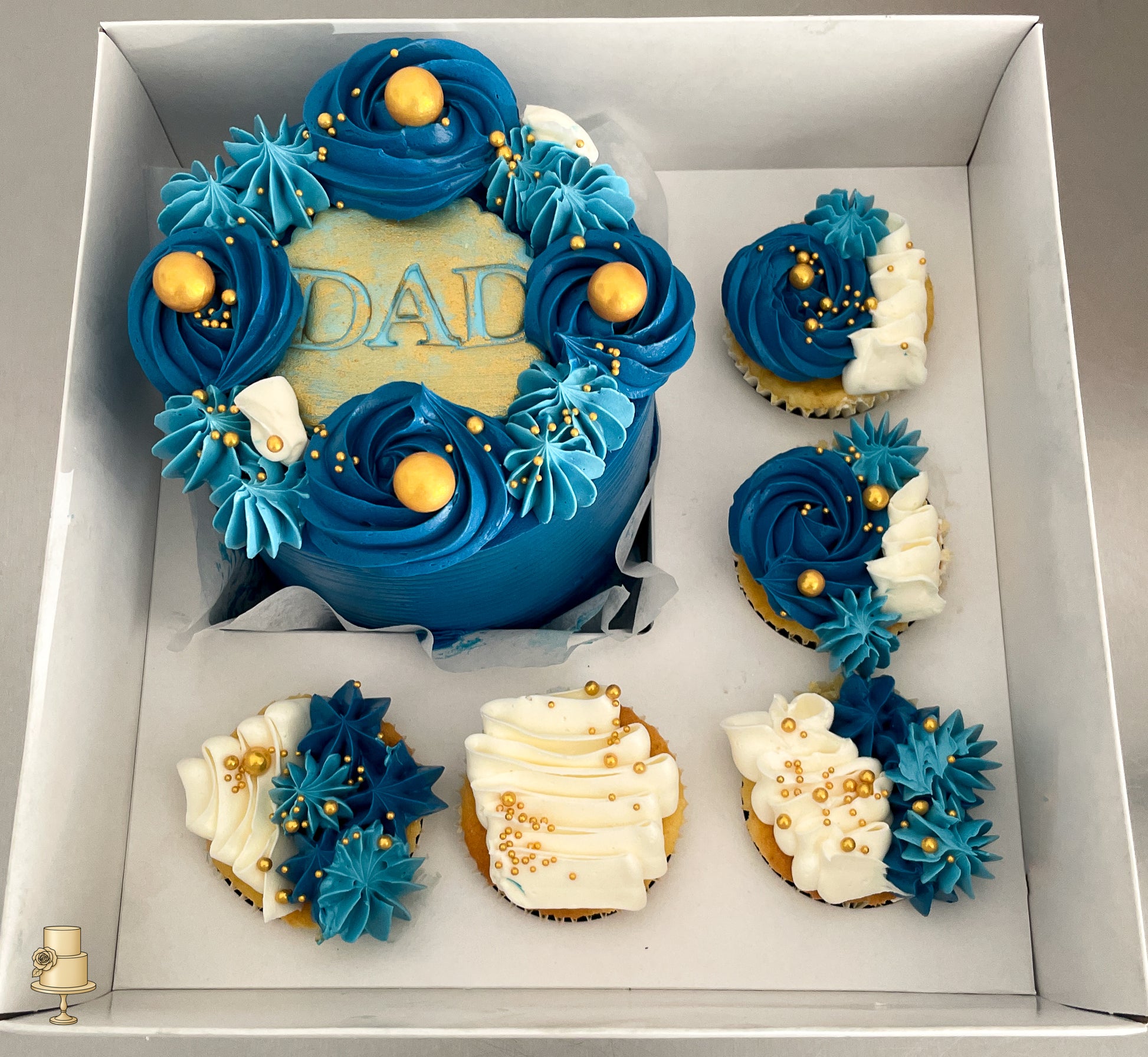 Bento Cake and cupcakes with blue and white buttercream icing